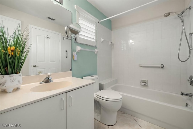 full bathroom with vanity, tiled shower / bath, toilet, and tile patterned floors