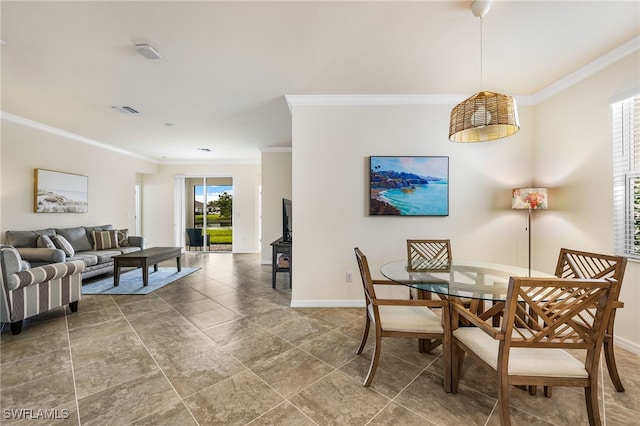 dining area with ornamental molding