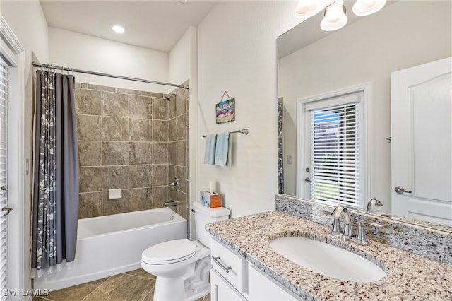 full bathroom with vanity, shower / bath combination with curtain, tile patterned floors, and toilet