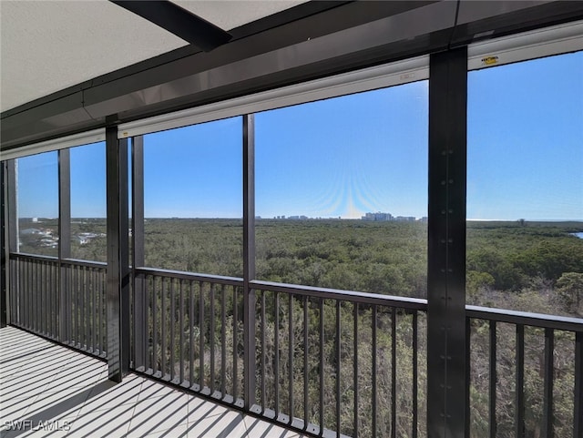 unfurnished sunroom with plenty of natural light