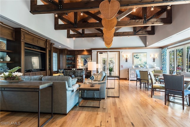 living room with high vaulted ceiling, wooden ceiling, beam ceiling, and light hardwood / wood-style floors