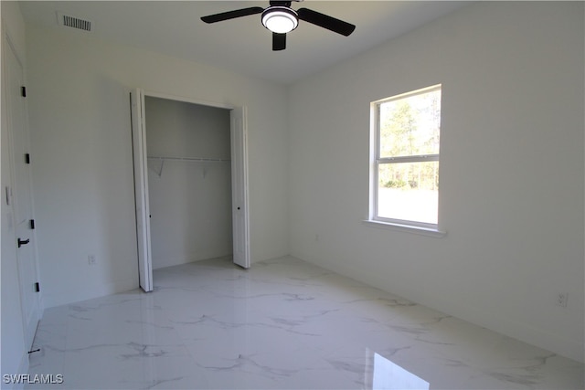 unfurnished bedroom featuring a closet and ceiling fan