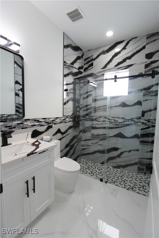 bathroom with walk in shower, vanity, toilet, and tile walls