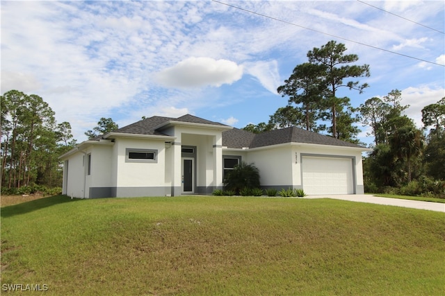 prairie-style home with a front lawn and a garage