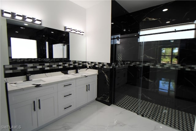 bathroom featuring vanity and a shower with shower door