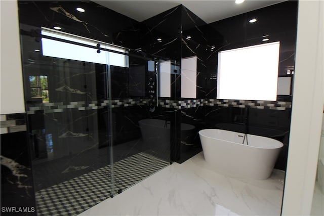 bathroom with plus walk in shower and tile walls