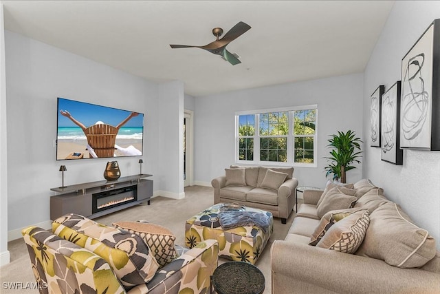 living room featuring ceiling fan and light colored carpet