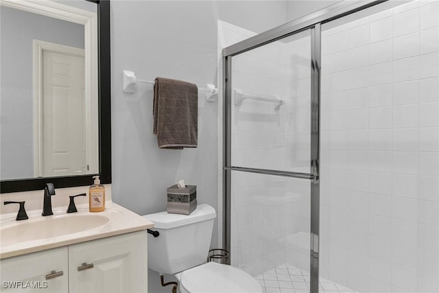 bathroom with vanity, toilet, and walk in shower