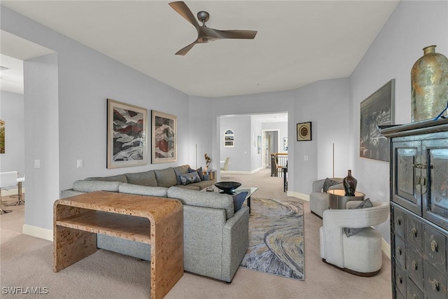 living room featuring ceiling fan and light carpet