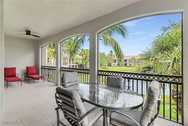 9219 Corfu Ct Unit 202, Naples, FL 34114 - view of patio with ceiling fan and outdoor dining space