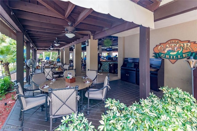 9219 Corfu Ct Unit 202, Naples, FL 34114 - wooden terrace featuring outdoor dining area and a ceiling fan