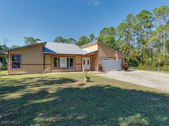 ranch-style house with a garage and a front yard