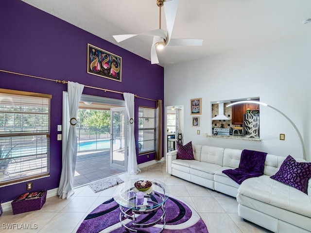 tiled living room featuring ceiling fan