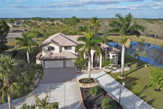 birds eye view of property with a water view