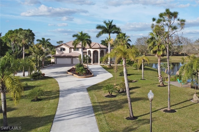 view of home's community featuring a lawn and a water view