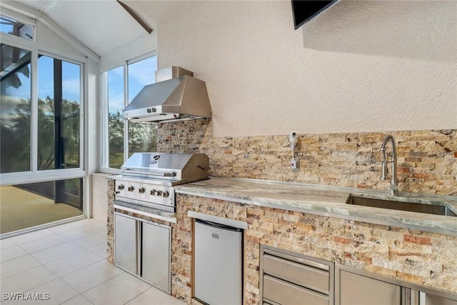 view of patio featuring area for grilling and sink