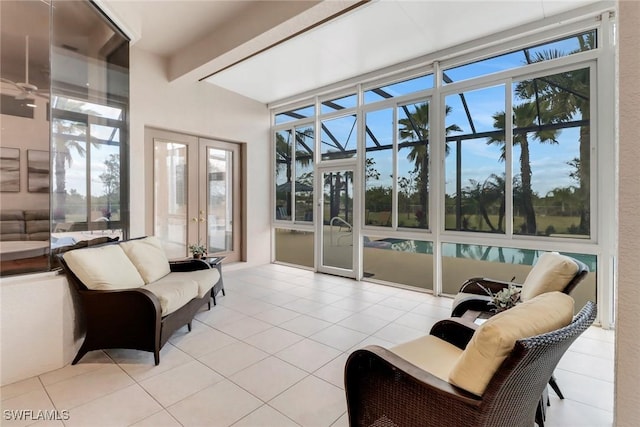 tiled living room featuring french doors