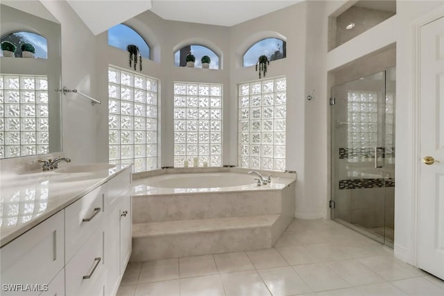 bathroom with vanity, tile patterned floors, and independent shower and bath