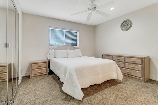 carpeted bedroom with a closet and ceiling fan