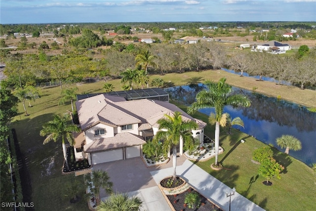 birds eye view of property with a water view