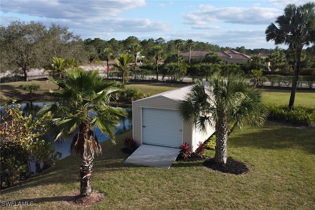 exterior space with an outbuilding and a garage