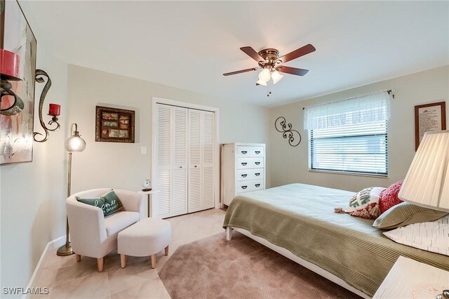 bedroom featuring ceiling fan and a closet