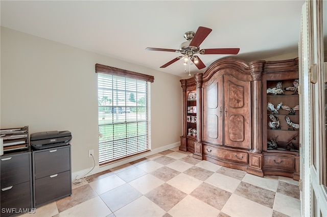 interior space with ceiling fan