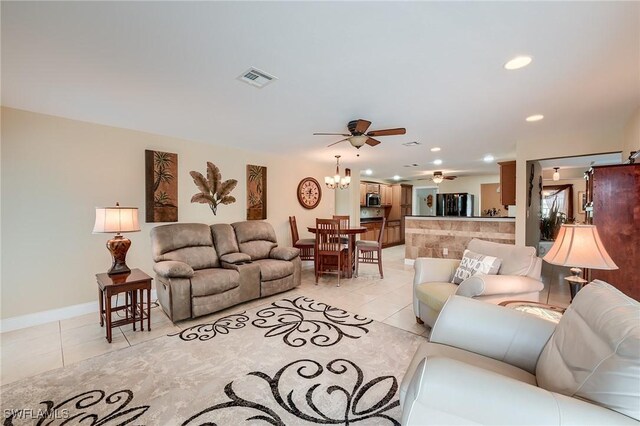 living room featuring ceiling fan and light tile patterned floors