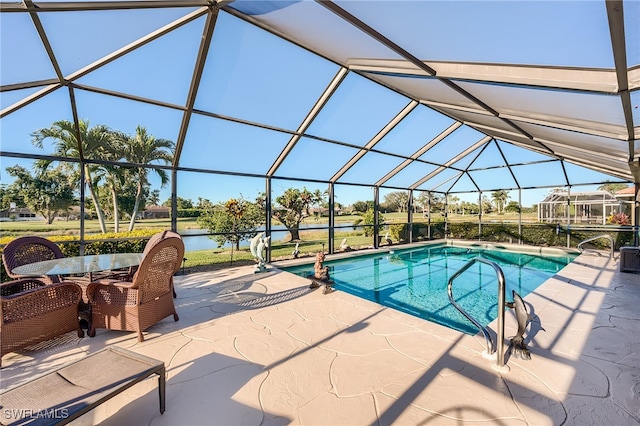 outdoor pool with a lanai and a patio