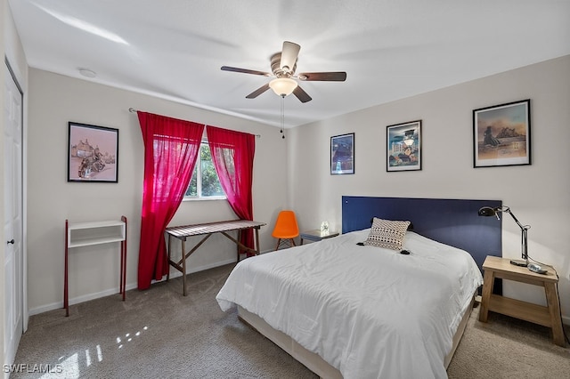 carpeted bedroom with ceiling fan and a closet