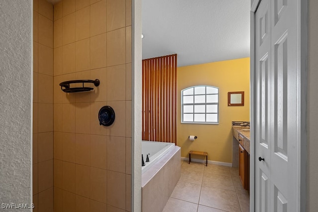 bathroom featuring tile patterned flooring, vanity, a textured ceiling, and plus walk in shower