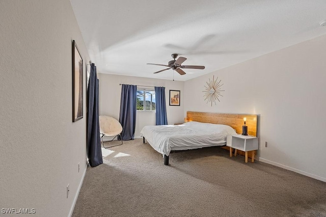 carpeted bedroom featuring a ceiling fan and baseboards