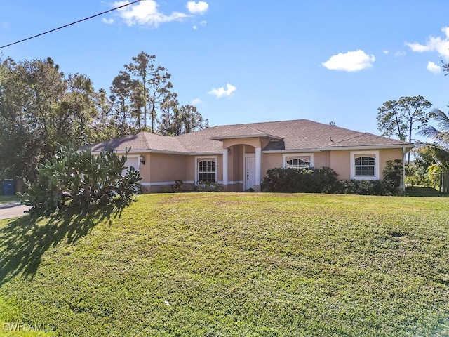 single story home featuring a front lawn