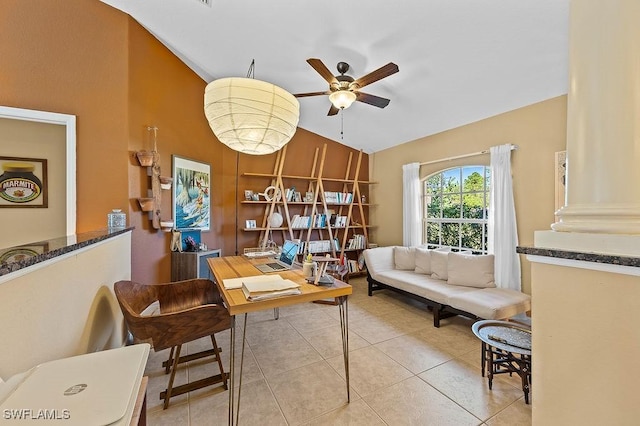 tiled office space with lofted ceiling and a ceiling fan