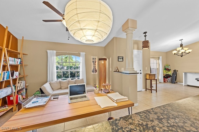 tiled office featuring ceiling fan with notable chandelier, decorative columns, and lofted ceiling