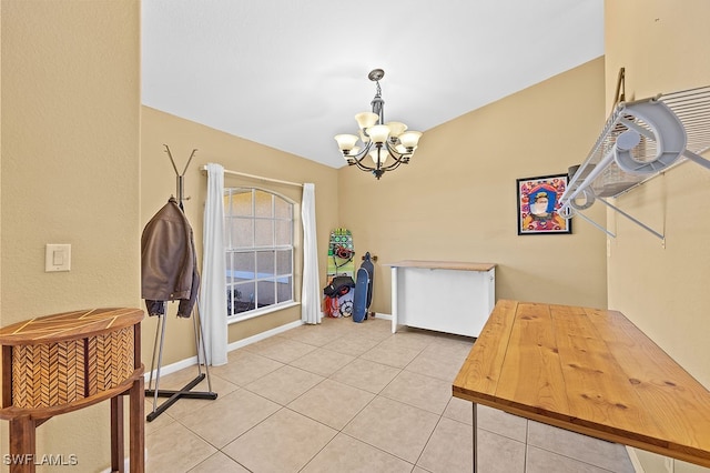 tiled dining area with a notable chandelier