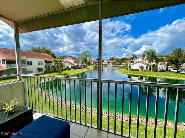 balcony featuring a water view