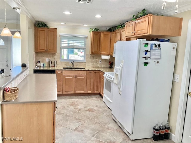 kitchen with pendant lighting, sink, white appliances, and crown molding