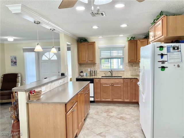 kitchen featuring sink, stainless steel dishwasher, white fridge with ice dispenser, pendant lighting, and decorative backsplash