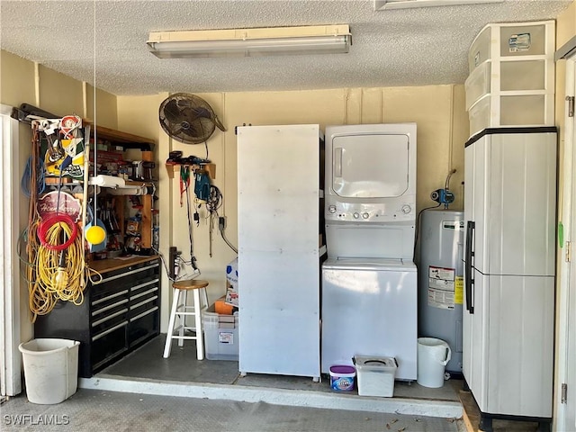 garage with stacked washer and dryer and water heater