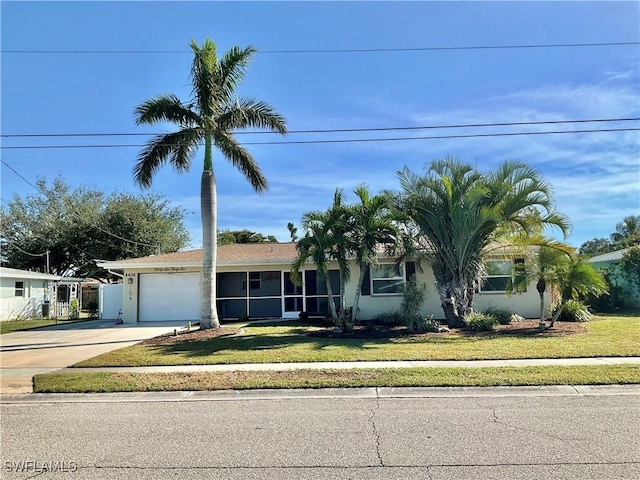 view of front of house with a garage and a front yard