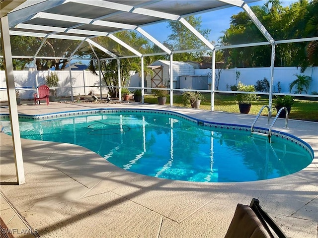 view of swimming pool featuring a patio area and glass enclosure