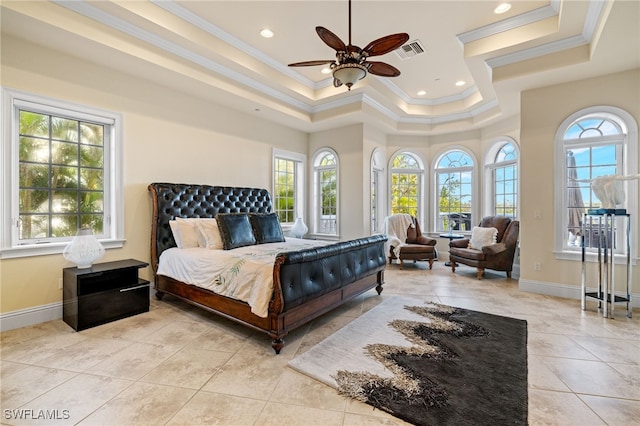 tiled bedroom with a tray ceiling, ceiling fan, and crown molding