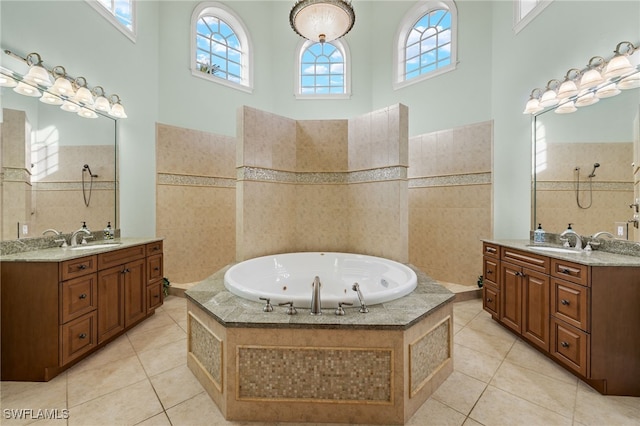 bathroom with tile patterned flooring, plenty of natural light, and a high ceiling