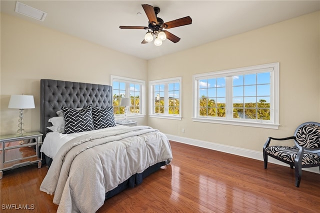 bedroom with hardwood / wood-style floors and ceiling fan