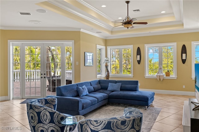 living room featuring ceiling fan, light tile patterned floors, crown molding, and french doors