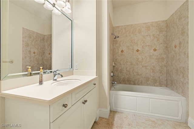 bathroom featuring tile patterned floors, vanity, and tiled shower / bath