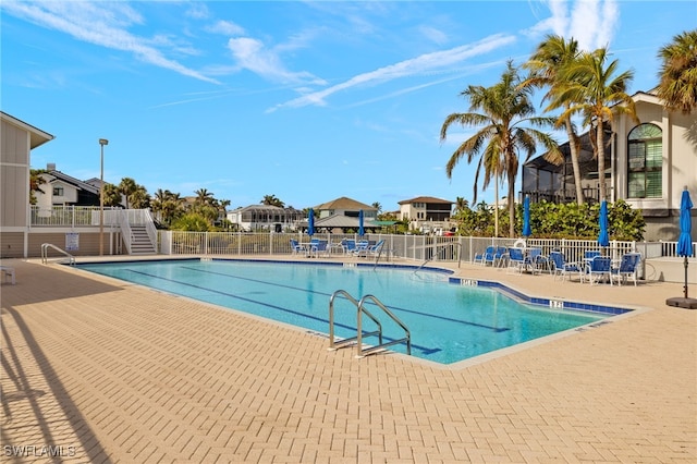 view of pool featuring a patio