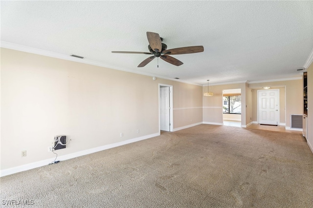 carpeted spare room with a textured ceiling, ceiling fan, and ornamental molding