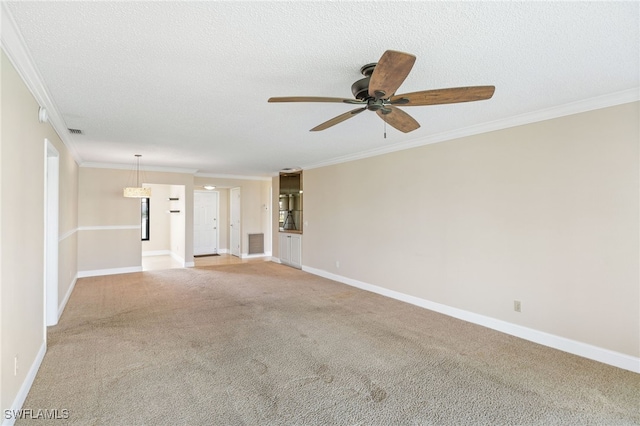 unfurnished living room with a textured ceiling, ceiling fan, ornamental molding, and light carpet